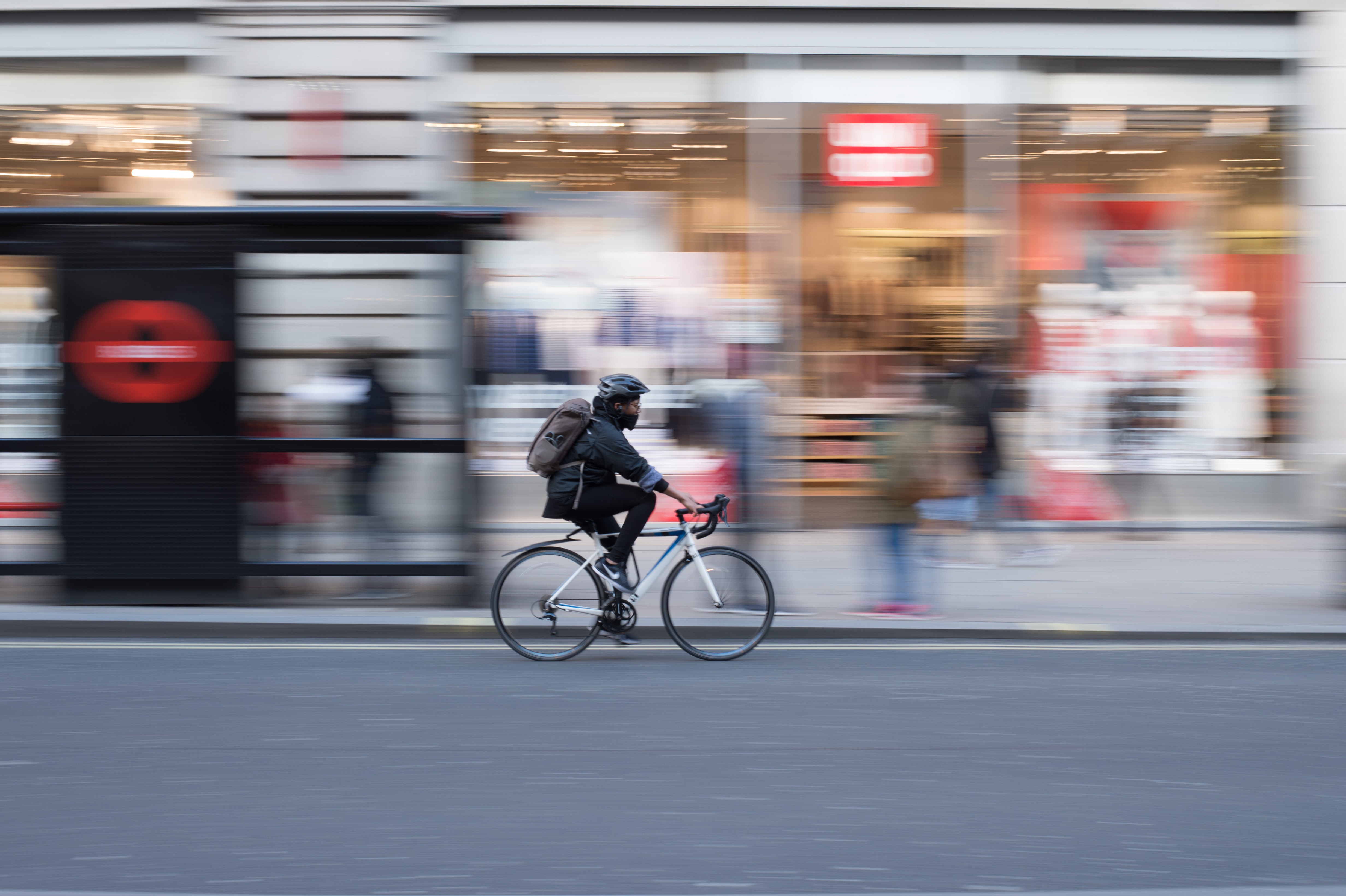 person cycling through city